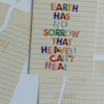 Torn papers with an uplifting quote emphasizing healing and overcoming anxiety and stress.